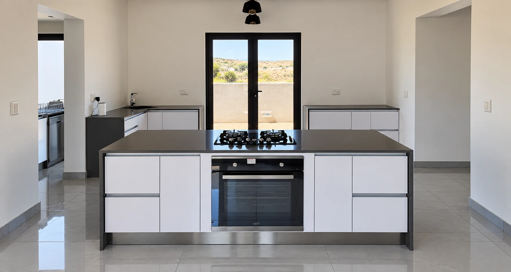 Modern white and charcoal custom kitchen with a large central island